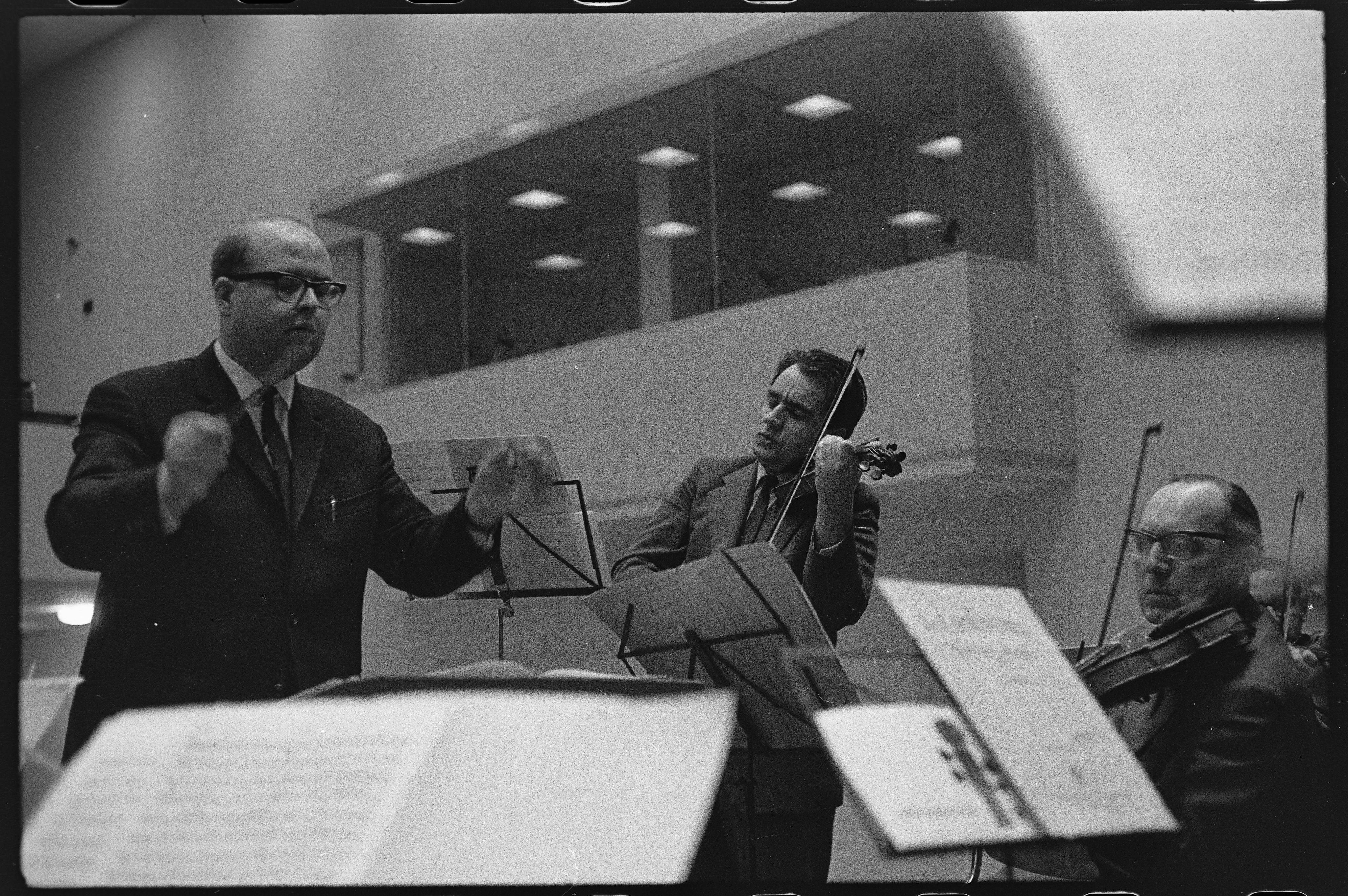 Walter Bauer conducting the chamber orchestra at the Karlsruhe Nuclear Research Center, February 4, 1965, photographer unknown. KIT Archives 28028/18731.